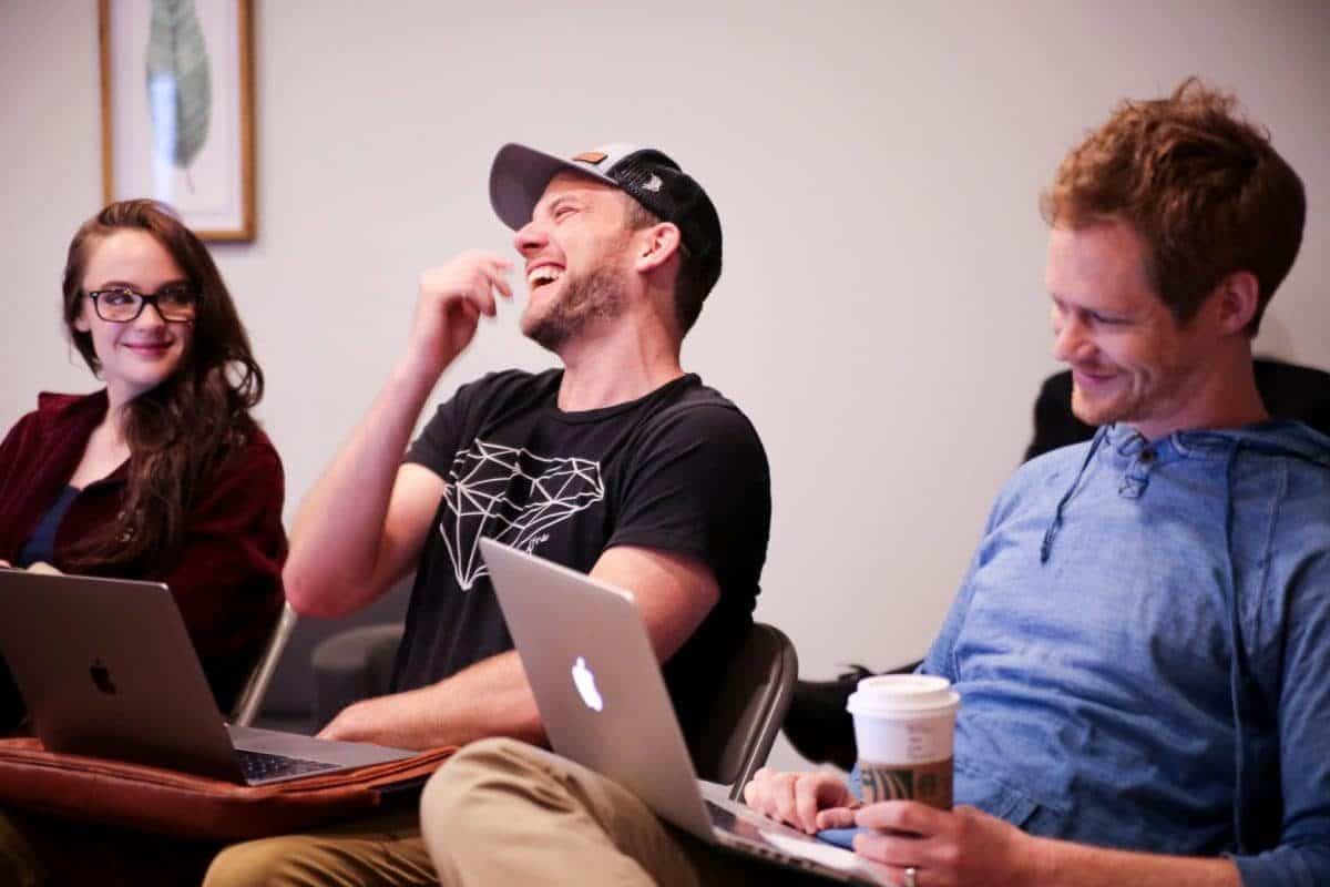 Actors Stevie Lynn Jones, David Abed, and Brian Norris share a laugh.